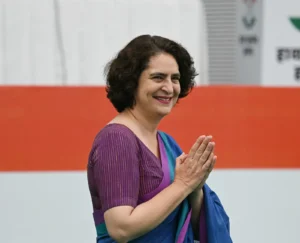 priyanka-gandhi-vadra-gestures-at-her-arrival-to-her-party-manifesto-release-april-5-2024